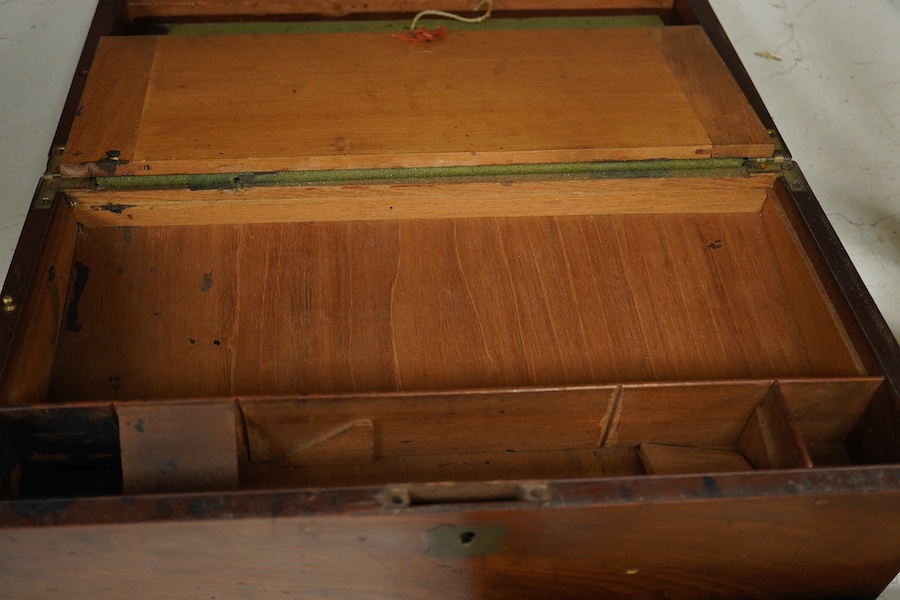 A 19th century brass handled figured mahogany writing slope, 42cm wide, 16cm high. Condition - brass inset plaque to top missing